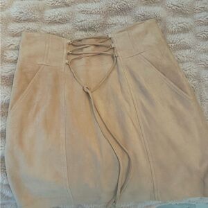 Light pink suede mini tie up skirt